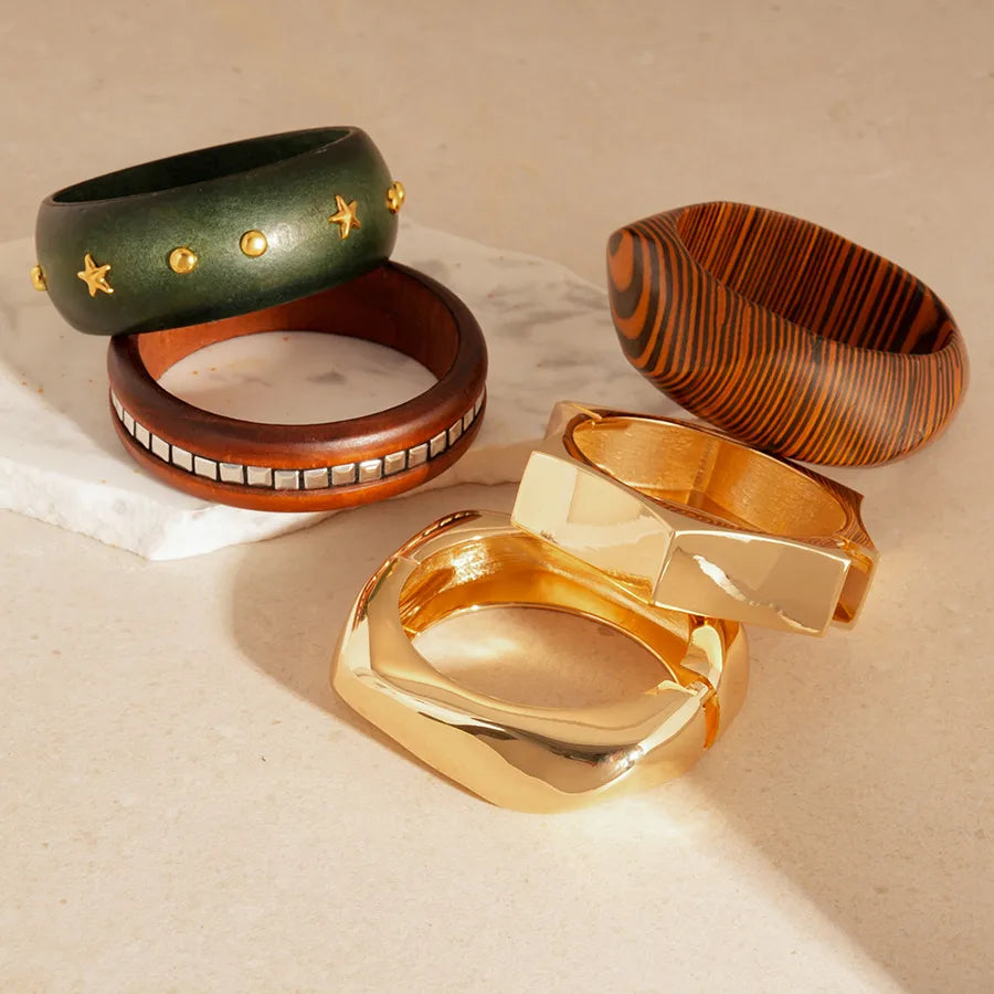 Mirror gold sculptural wave cuff bangle, high-shine finish