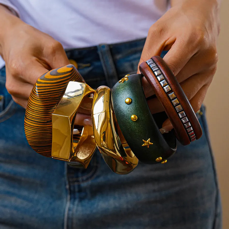 Mirror gold geometric hexagon cuff bangle on model — statement metal bracelet