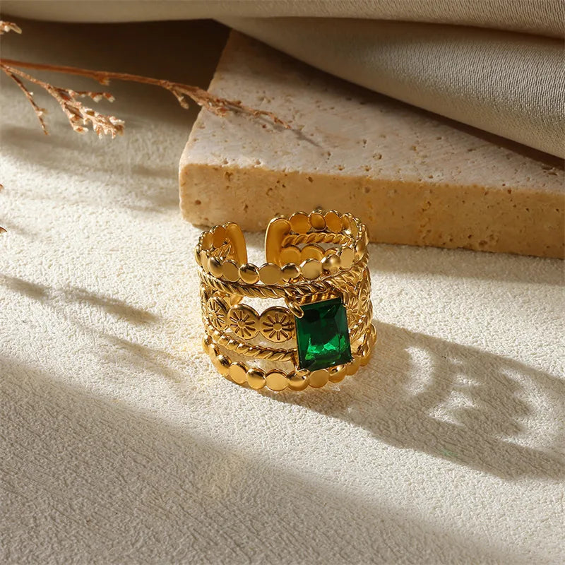 iscover The Layers’ Golden Muse Ring Set — 10 adjustable gold-plated rings with gemstone and floral accents. Stack, style, or gift timeless elegance. Shop online now