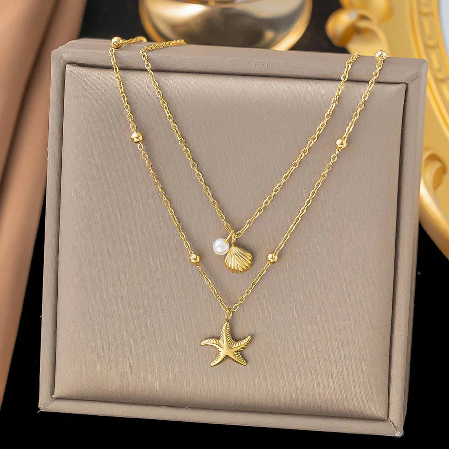SeaMuse Layered Gold Necklace – Starfish and shell charms with pearl accent on delicate chain – Layers Store UK