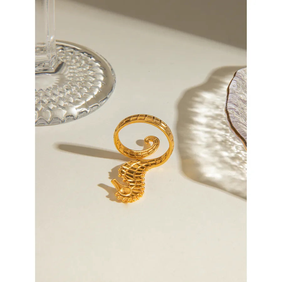 Discover The Layers’ Golden Tide Seahorse Ring — an adjustable gold-plated ocean-inspired statement ring. Perfect for beach lovers and everyday elegance. Shop now!