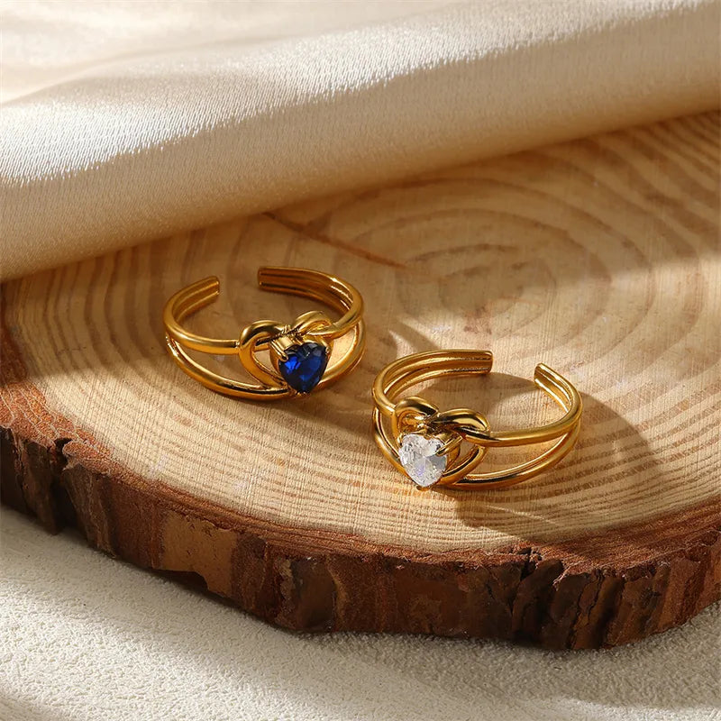 iscover The Layers’ Golden Muse Ring Set — 10 adjustable gold-plated rings with gemstone and floral accents. Stack, style, or gift timeless elegance. Shop online now