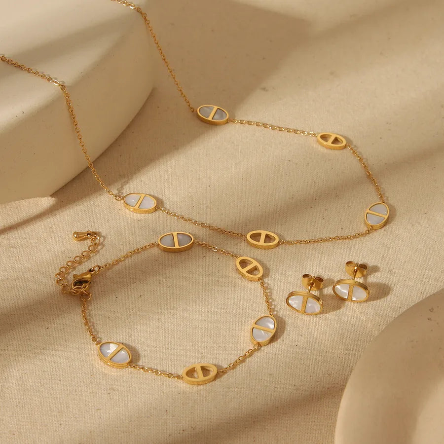 LineaSet – Minimalist gold oval jewellery set with white enamel inlay – necklace, bracelet, and earrings by Layers Store UK