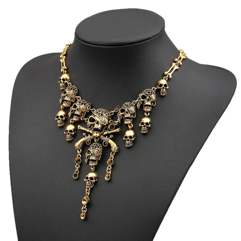 Shop ‘Skull Royale’ – layered gold skull charm necklace with gothic detailing. Statement Halloween jewellery from the Spooky Stack Collection at Layers.Store UK.