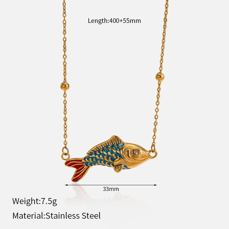 Set of gold-plated charm necklaces featuring moon, bow, gemstone, and enamel fish pendants — elegant handcrafted jewelry from The Layers.