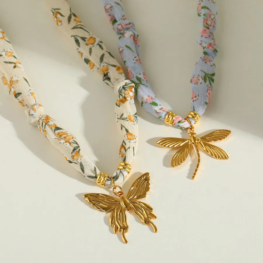 FlutterWhim Necklace – Layers Store UK – Floral scarf wrap with butterfly and dragonfly gold charms