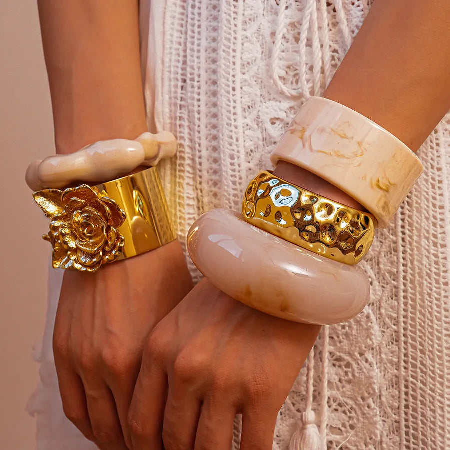 PowerStacks bold bangle collection – gold sculpted and resin bangles styled in layered wrist stack – Layers Store UK