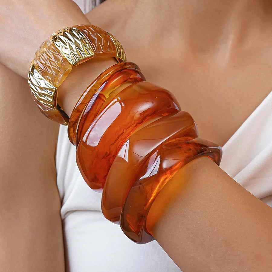 Slim amber resin bangle ring with light-catching gloss